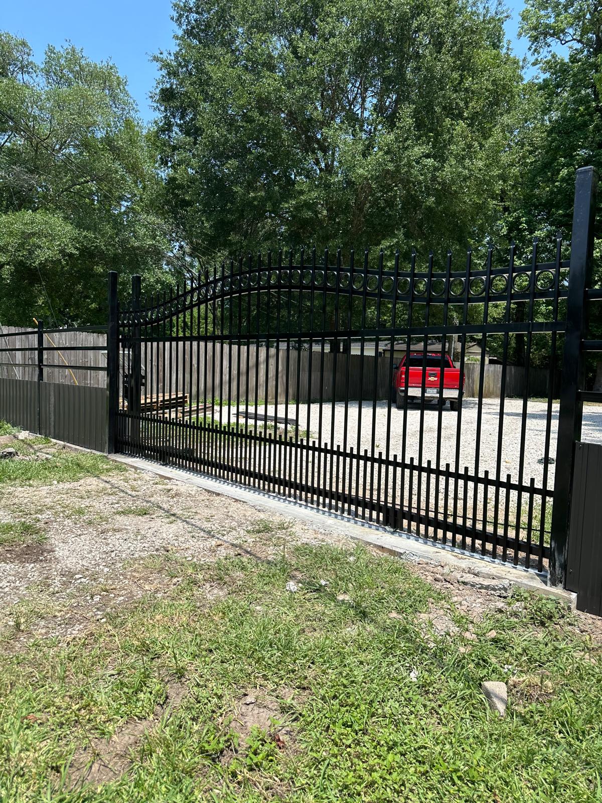 Black iron spear-top sliding gate in Houston