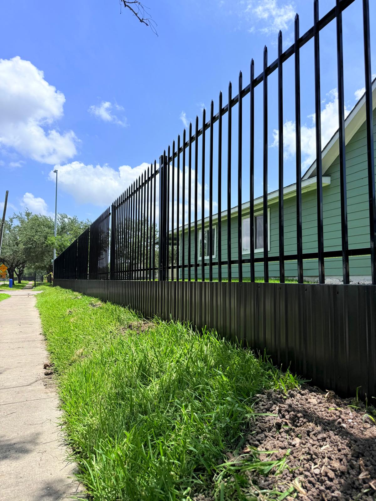 Tall ornamental iron fence panel ready for installation